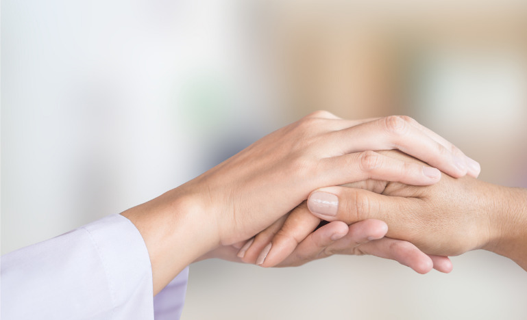 Doctor comforting a patient