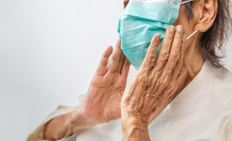 Elderly woman wearing a mask