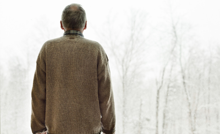 Senior man facing the winter