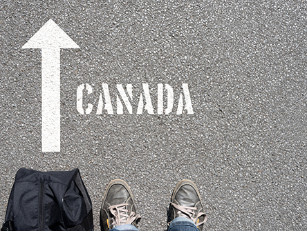 A man with a travel bag on his way to Canada