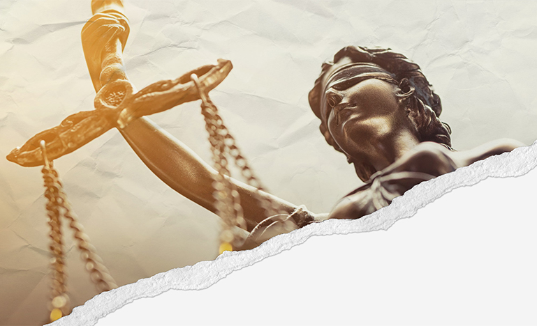 Ripped and crumpled image of lady justice