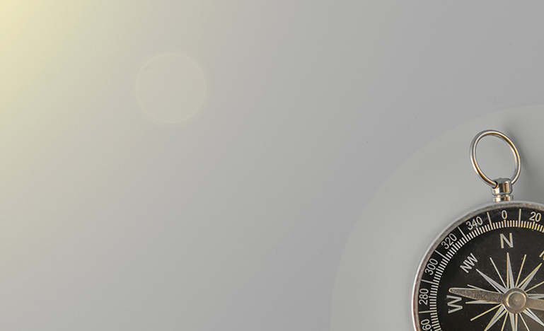 Compass on grey background