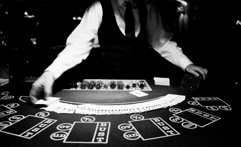 A casino employee deals cards