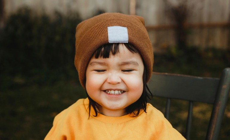 A young Indigenous child smiles