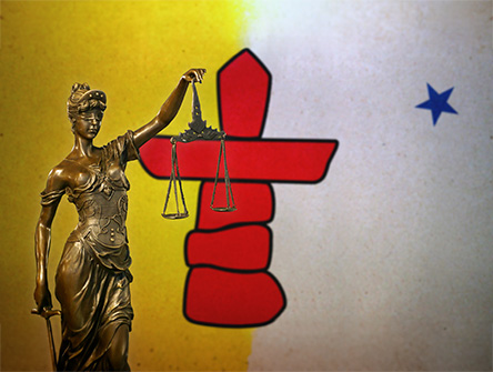 Lady Justice before a flag Nunavut