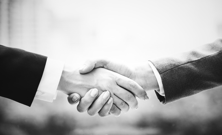 Close up of two people shaking hands