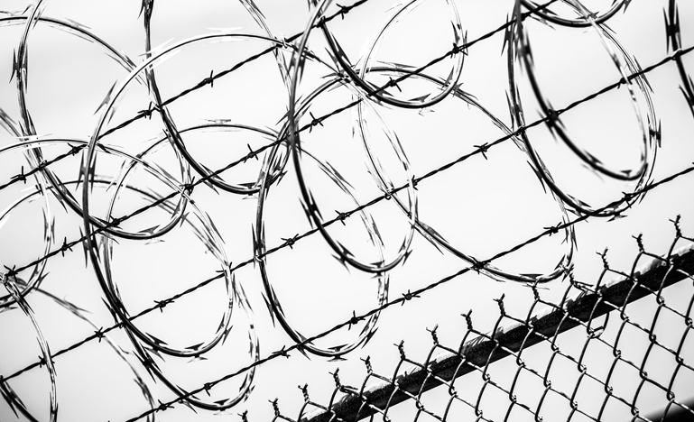 Barbed wire on prison grounds