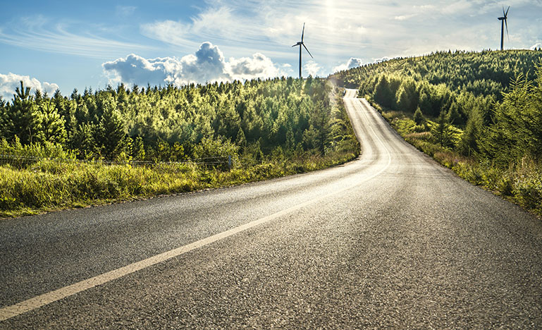 Road looking on wind turbines