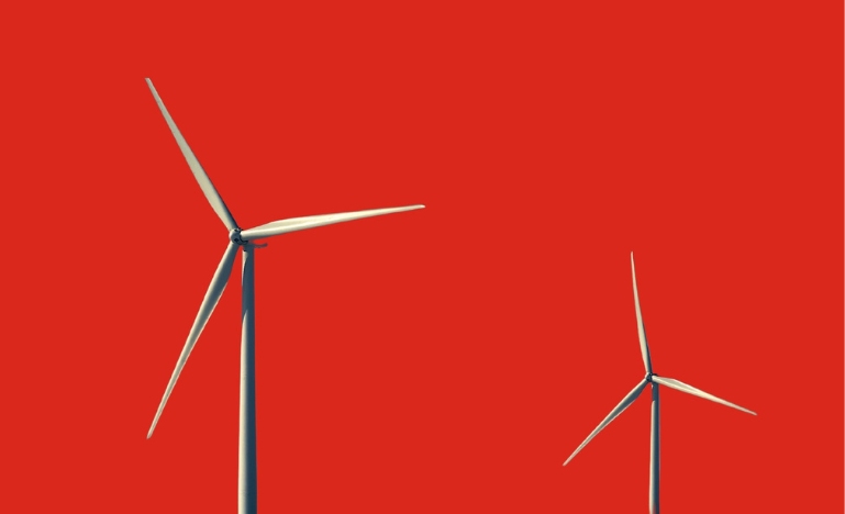 Wind turbines on red background