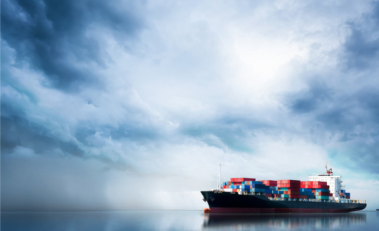 Trade cargo ship in uncertain weather