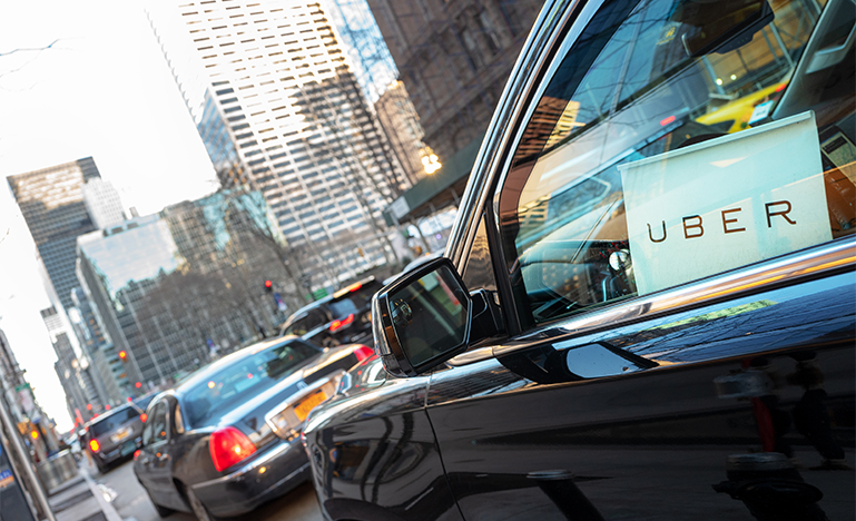 Car with Uber sign in window