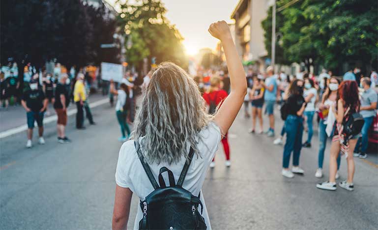 Woman raising fist in protest