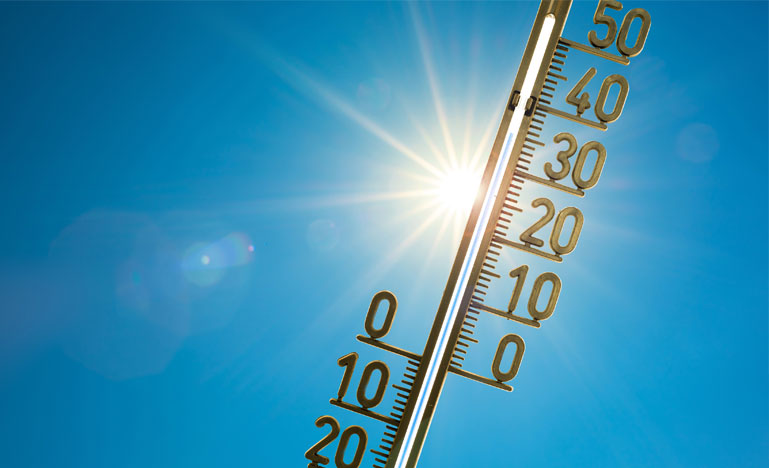 Thermometer with sun in background