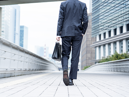 business man walking away