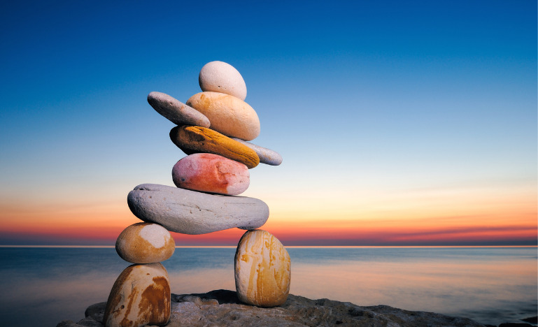 Inukshuk and fading sun