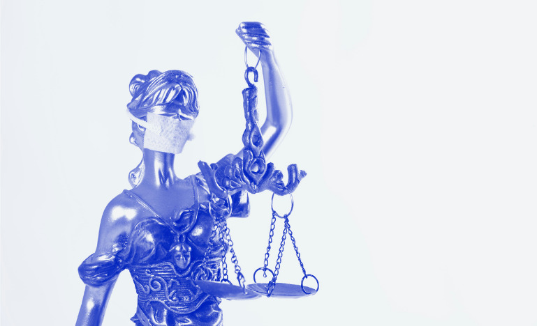 Lady justice wearing a mask