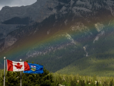 Canadian and alberta flags flying separately