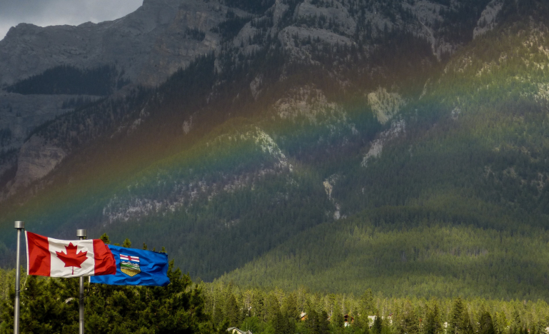 Canadian and alberta flags flying separately