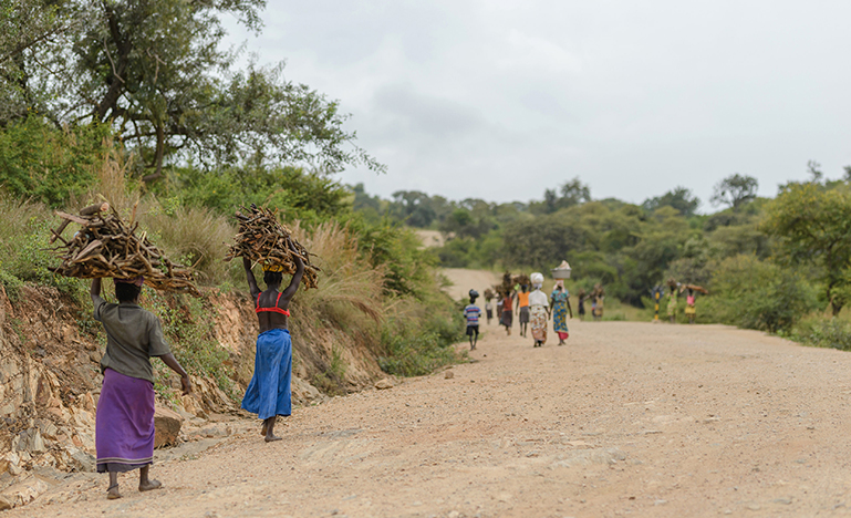 Women travelling a road in Buliisa District Uganda