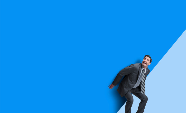 Businessman cowering in fear