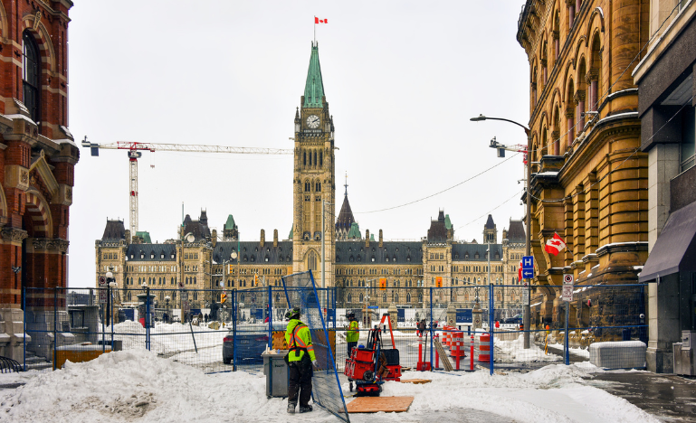 A fence remains in place one week after police cleared the area near Parliament Hill of trucker convoy protesters in 2022
