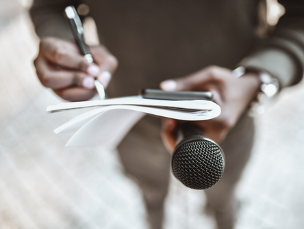 A journalist prepares questions for a press conference
