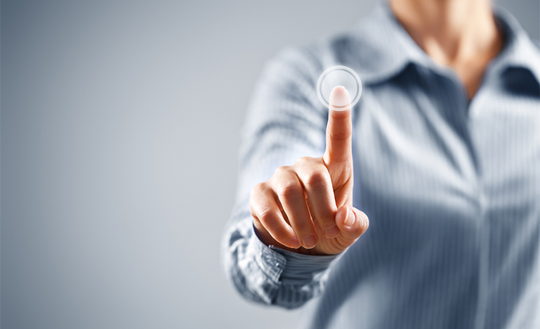 Businesswoman pressing button on touch screen