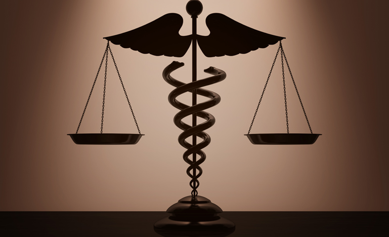 Medical Caduceus Symbol as Scales with backlight over Wall