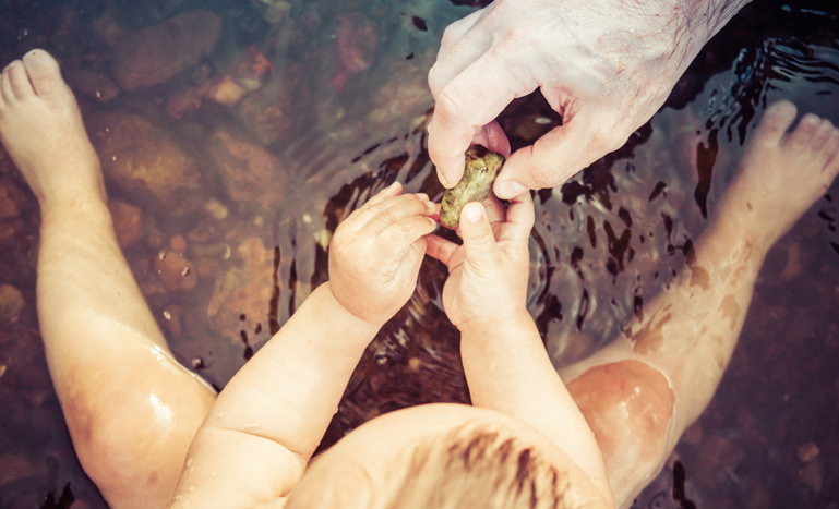 Baby playing in water