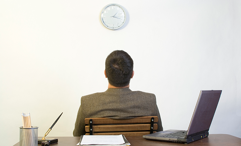 Man looking at clock