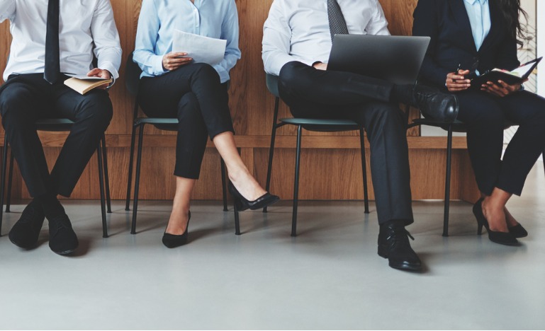 diverse group of people waiting for an interview
