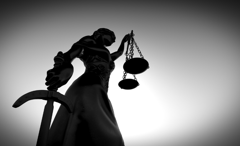Themis with the scales of justice and a sword.