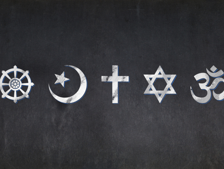 The religious symbols of Buddhism, Islam, Christianity, Judaism, and Hinduism on a blackboard
