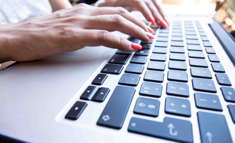 Close-up woman on laptop