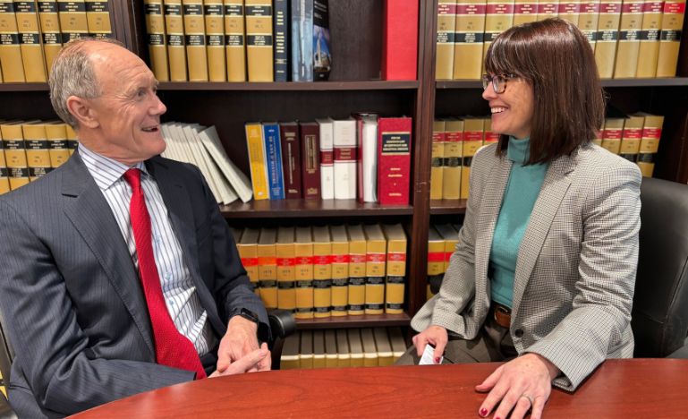 Federal Court Chief Justice Paul Crampton and podcast host Alison Crawford