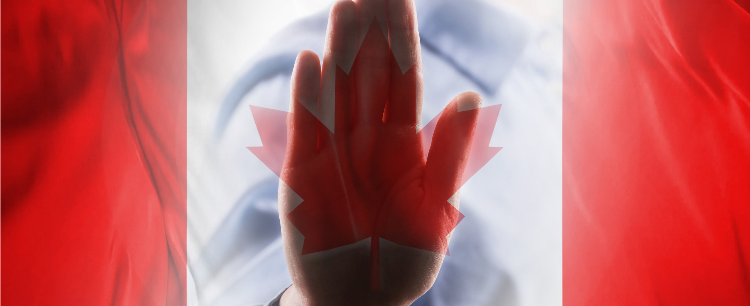 A Canadian flag with a hand stop sign