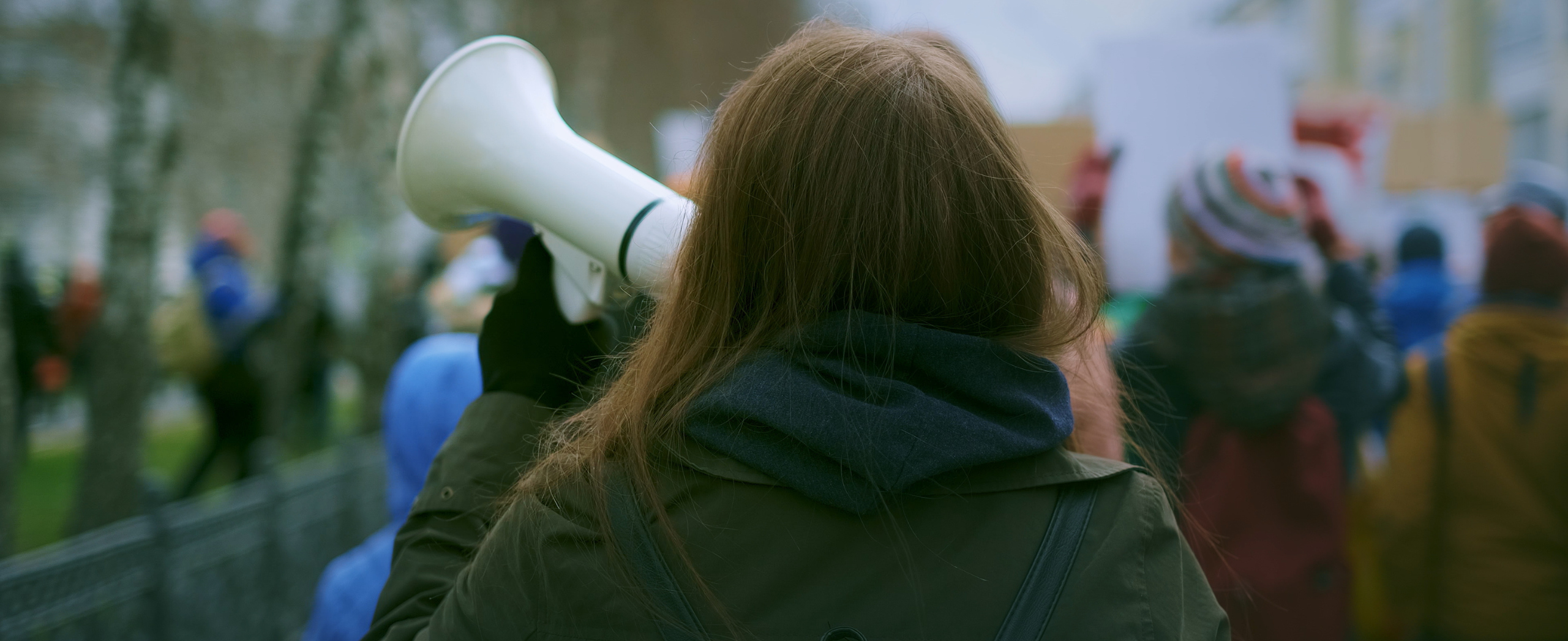 Woman on a megaphone during a labour strike