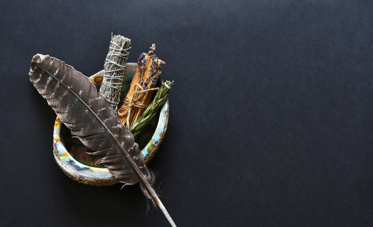 A spiritual smudge kit and eagle feather