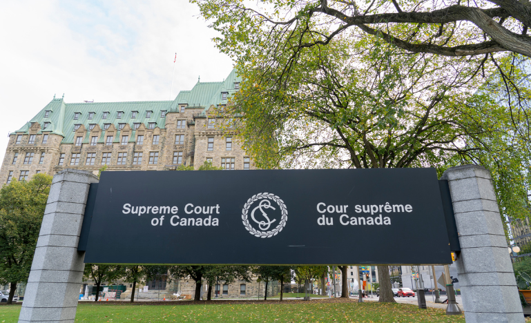 A sign on the lawn of the Supreme Court of Canada