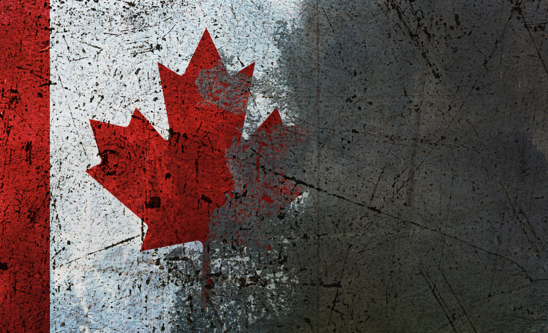 A partly shaded maple leaf on a Canadian flag