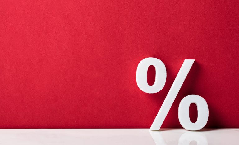 A white percentage sign on a red backdrop
