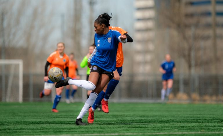 Montreal Roses player Latifah Abdu on a soccer field