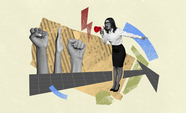 A woman with a megaphone facing fists thrust in the air