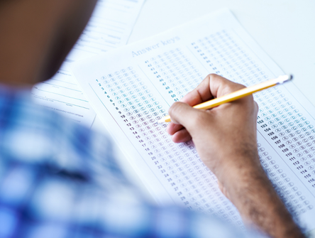 A student fills out a bar exam answer sheet