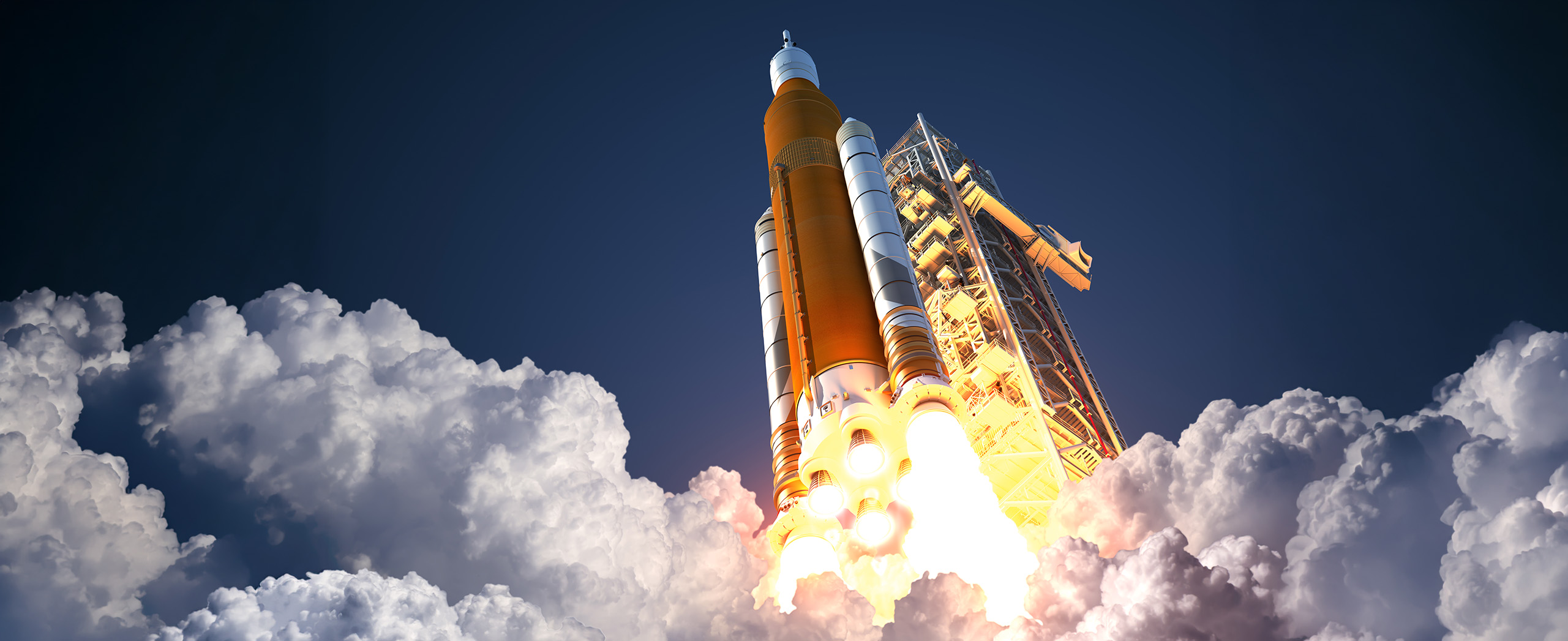 A large rocket launches, surrounded by billowing clouds of smoke and bright flames, against a clear blue sky, conveying power and excitement.