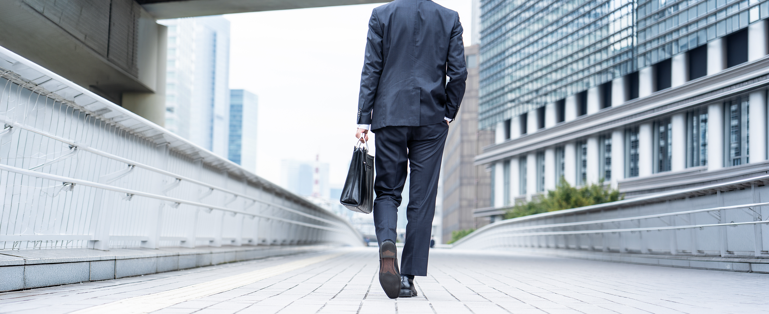business man walking away