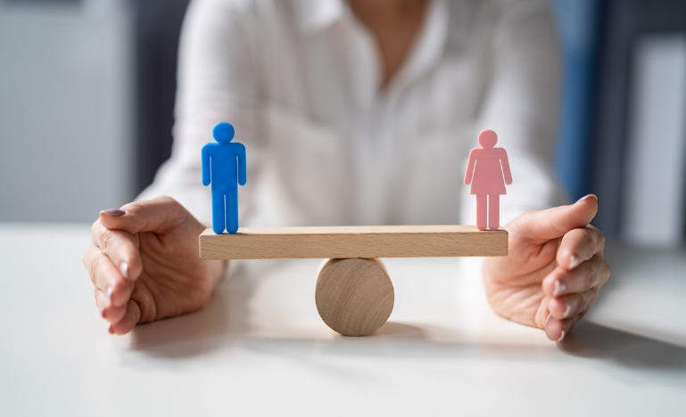 Gender balance and equity illustrated on a seesaw