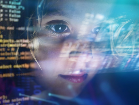 A child looks at a hollogram