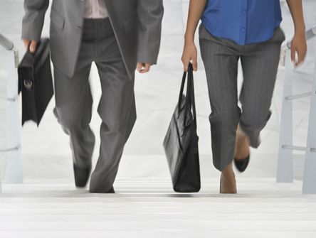 Two people walking up stairs